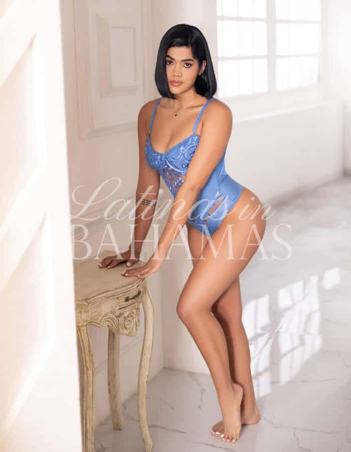 Stylish female companion in Nassau enjoying a sophisticated nightlife experience
