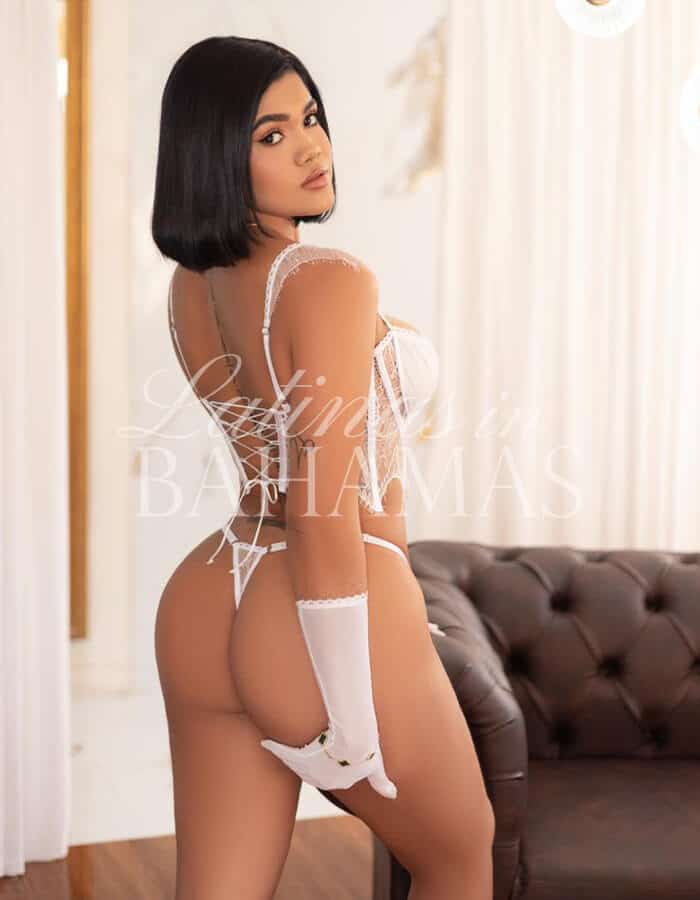 Stylish female companion in Nassau enjoying a sophisticated nightlife experience